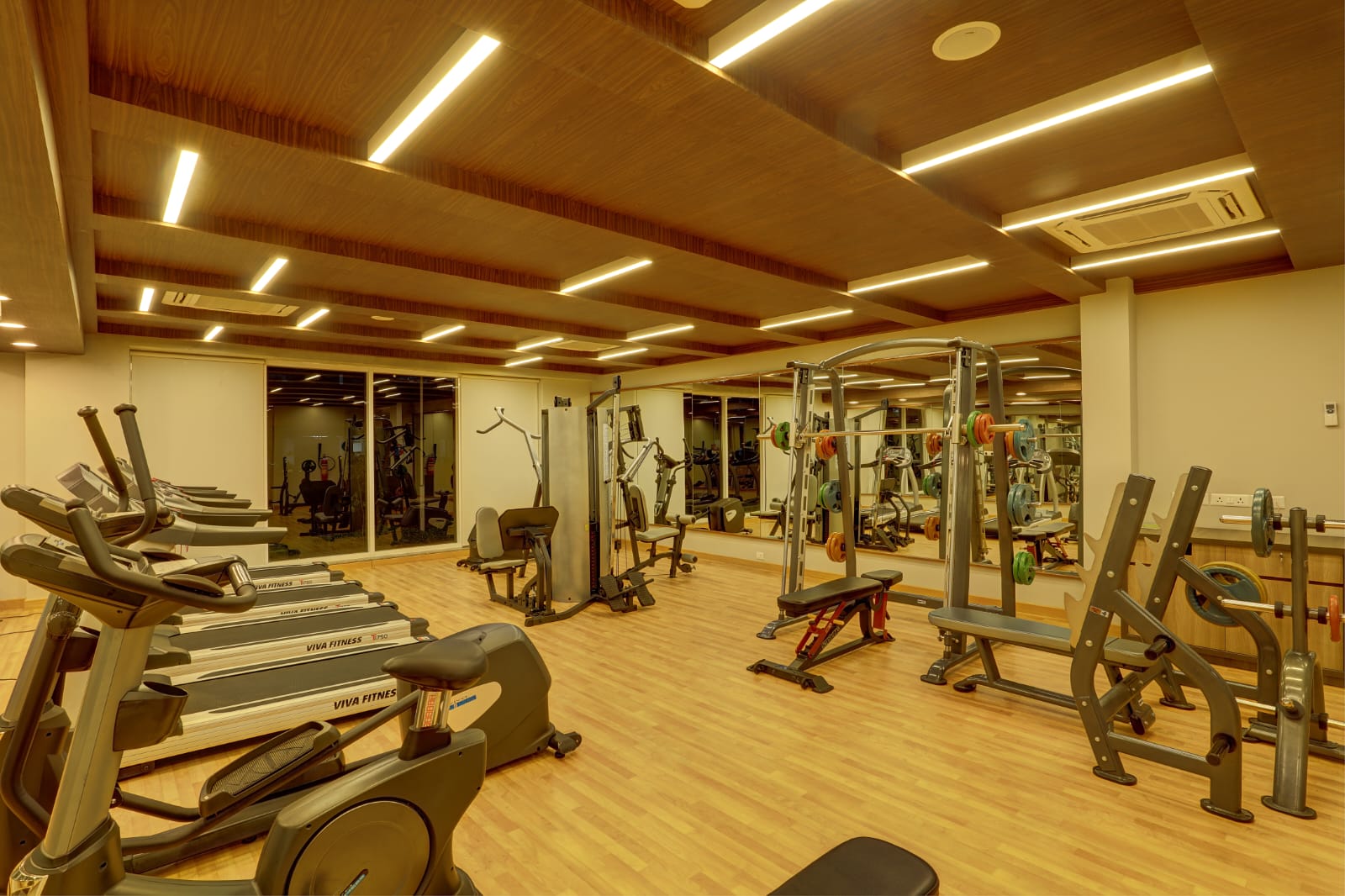 Modern gym interior design by Redwood Interiors in Kerala